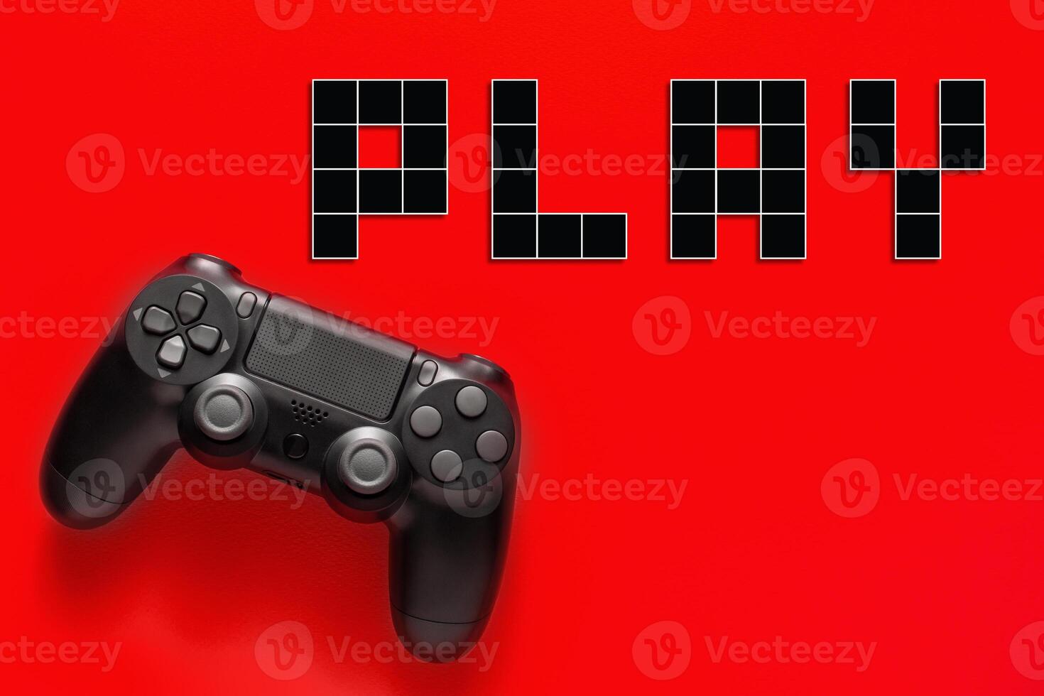 Black modern gamepad and word play on a colored background . Gaming concept photo