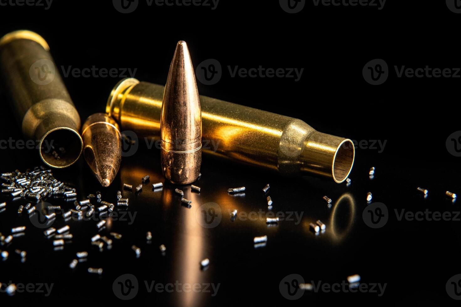 Bullet isolated on black background with reflexion. Rifle bullets close-up on black back. Cartridges for rifle and carbine on a black. photo