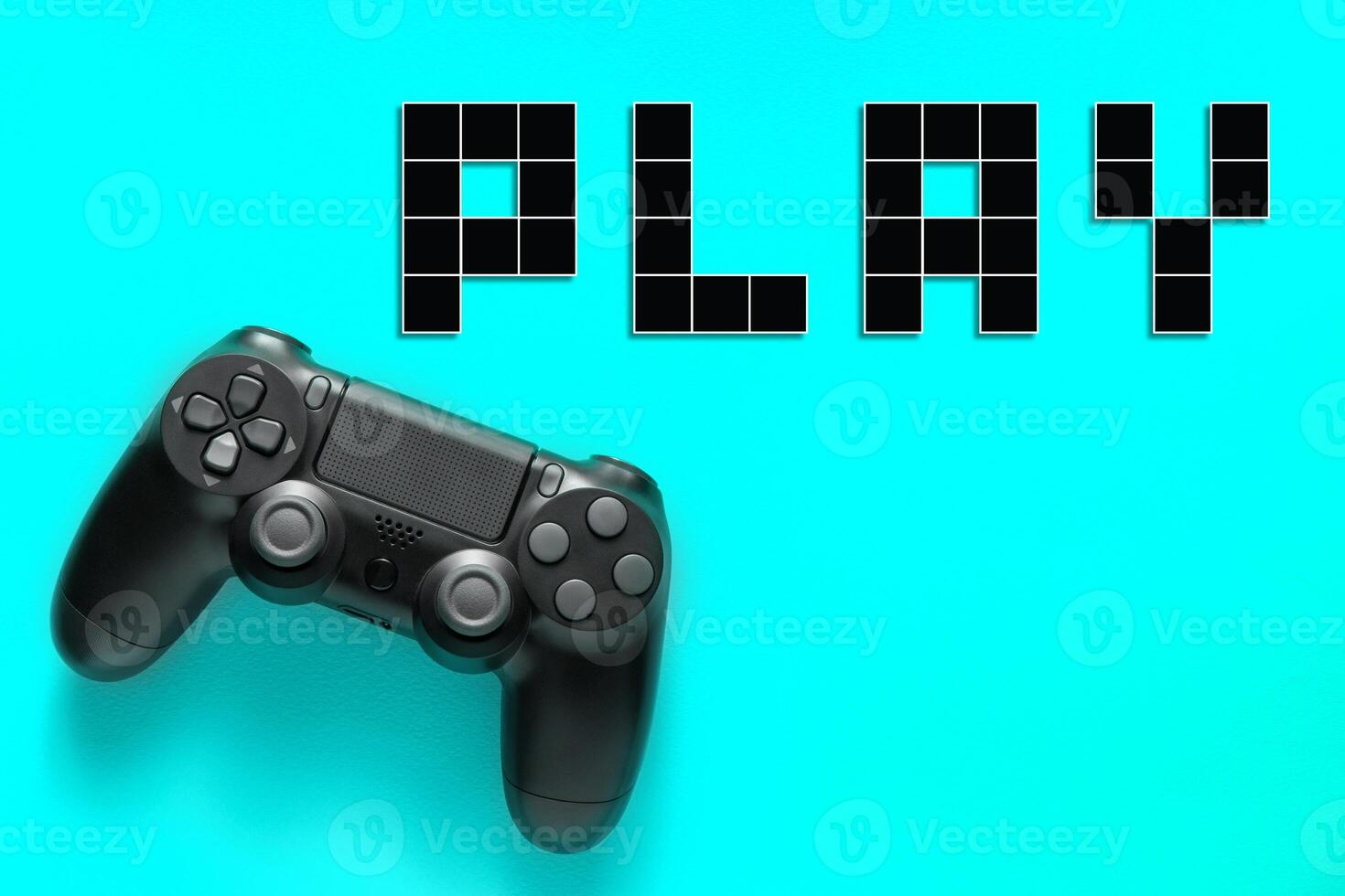Black modern gamepad and word play on a colored background . Gaming concept photo