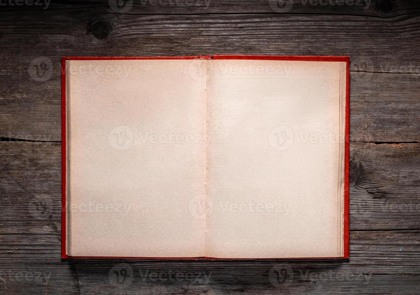 Vintage book, open, on old wooden table, with clipping path. Open Book blank on old wooden background. book with blank pages photo