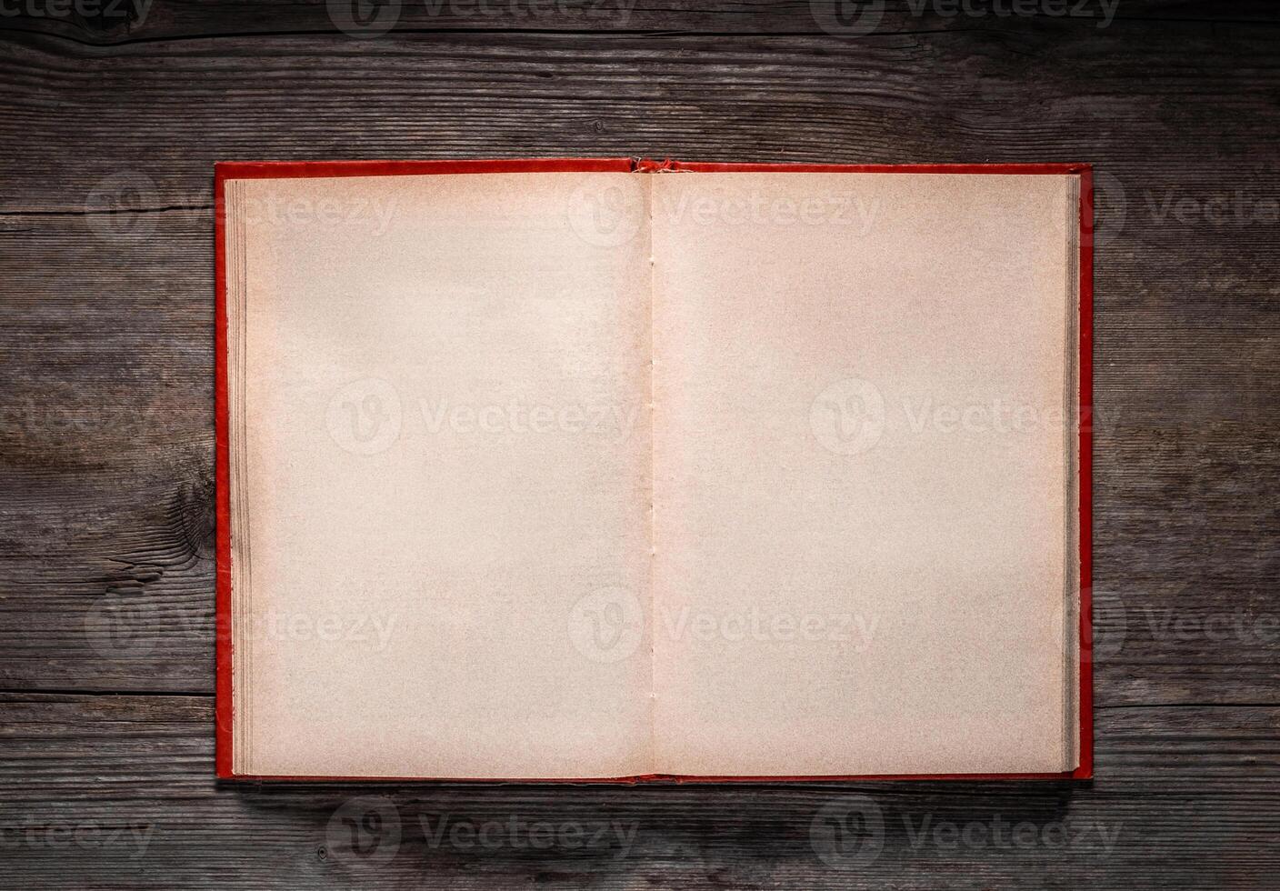 Vintage book, open, on old wooden table, with clipping path. Open Book blank on old wooden background. book with blank pages photo