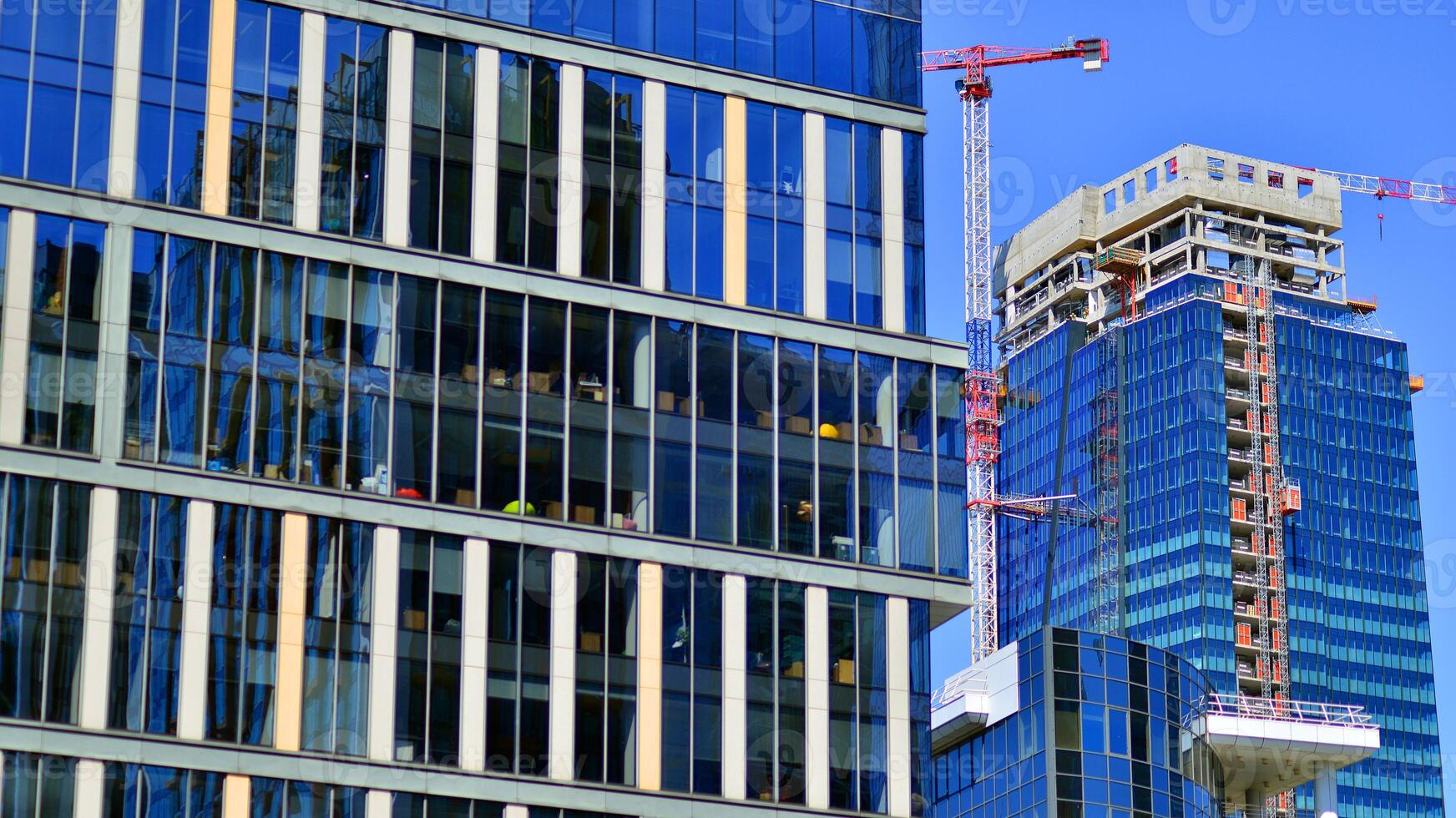 Modern sustainable glass office buildings. Exterior view of corporate headquarters glass buildings architecture.Glass windows in energy-efficient buildings. Financial business center buildings. photo