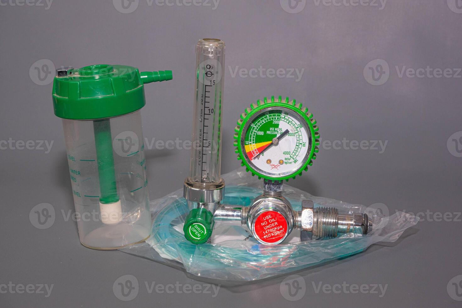 Medical Oxygen Equipment and Cylinder Regulator gauges. Pressure oxygen gas control for patient respiratory disease treatment and emergency CPR in Hospital, Focus close up on gray background. photo
