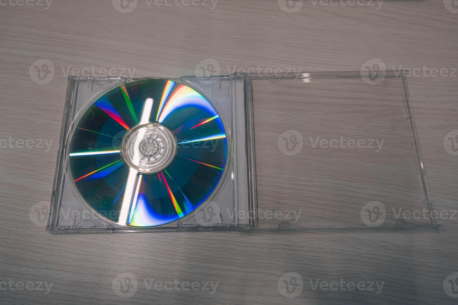 Stack of compact disks on a wooden table. Vcd, blueray photo