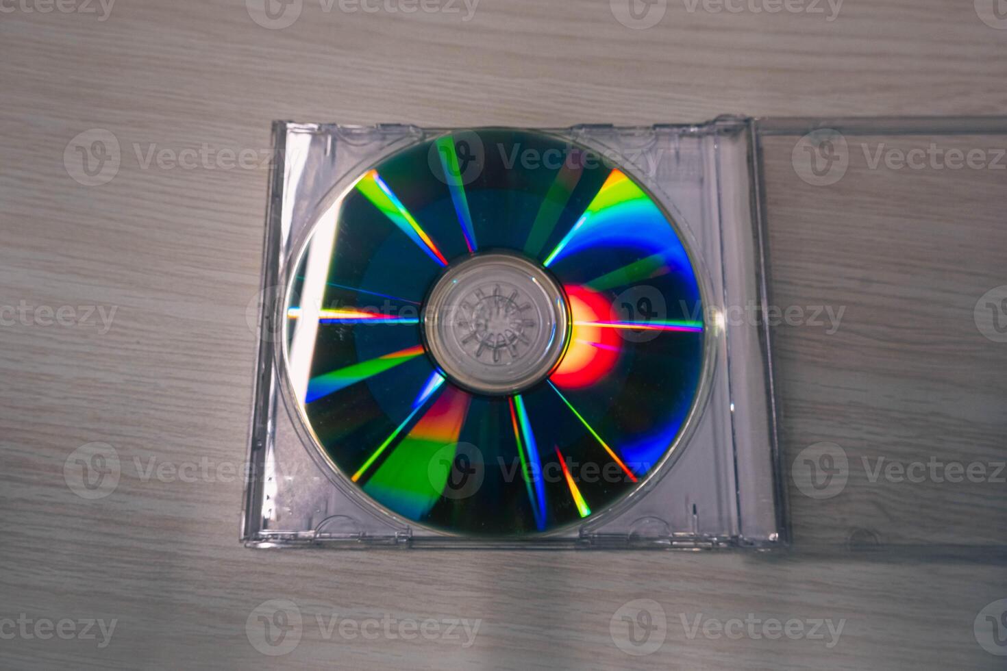 Stack of compact disks on a wooden table. Vcd, blueray photo