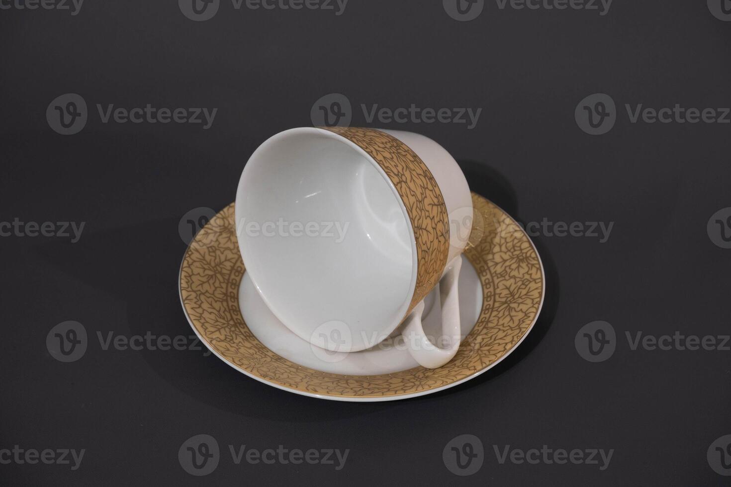 Ceramic cup with unique design isolated on grey background. Cooking utensil photo