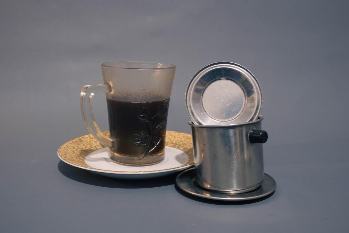 Vietnam Style Drip Coffee with Condensed Milk at the Bottom to Add Sweetness, Close Up photo