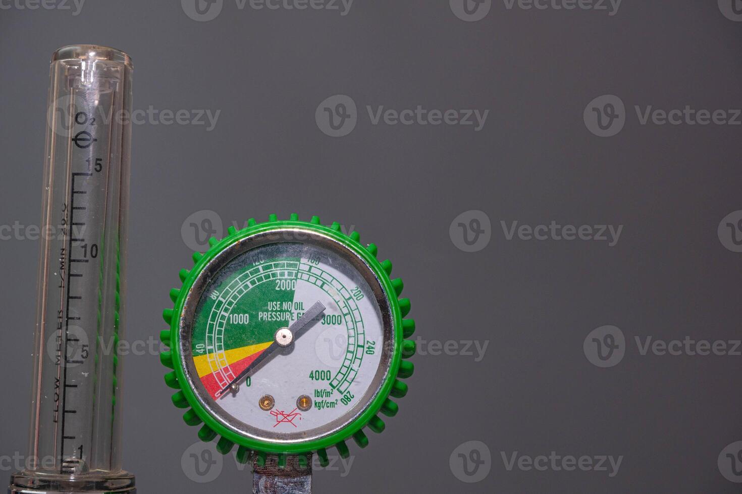 Medical Oxygen Equipment and Cylinder Regulator gauges. Pressure oxygen gas control for patient respiratory disease treatment and emergency CPR in Hospital, Focus close up on gray background. photo