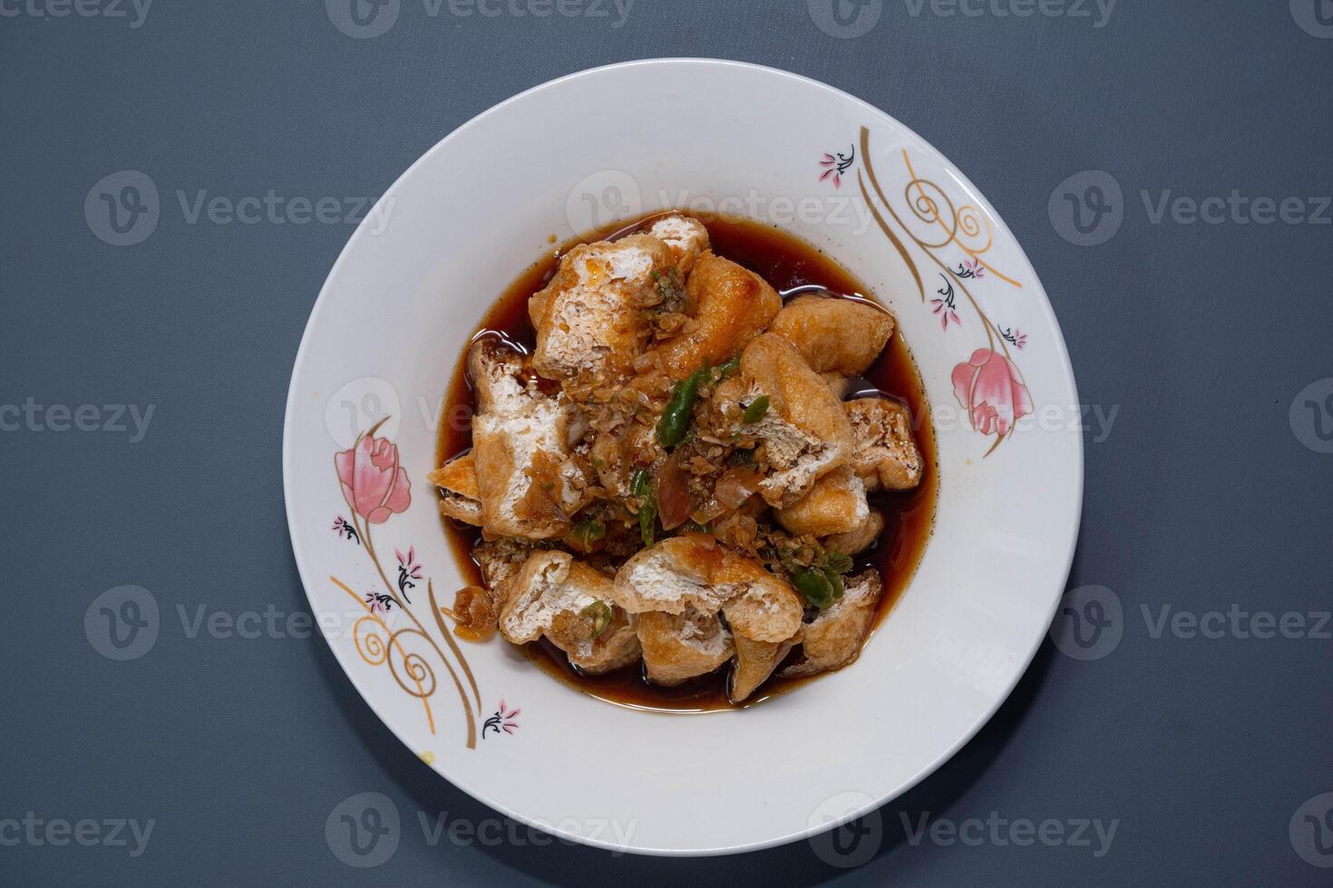 Tahu gejrot is a traditional Indonesian snack. Tahu Gejrot is a typical Indonesian spicy food. Made from fried tofu cut into small pieces, photo