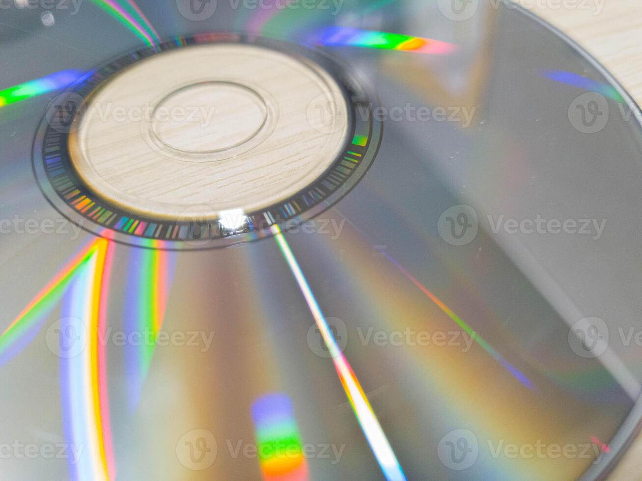 Compact disk on a wooden table. Stack of compact disc on a wooden table. Vcd, blueray photo