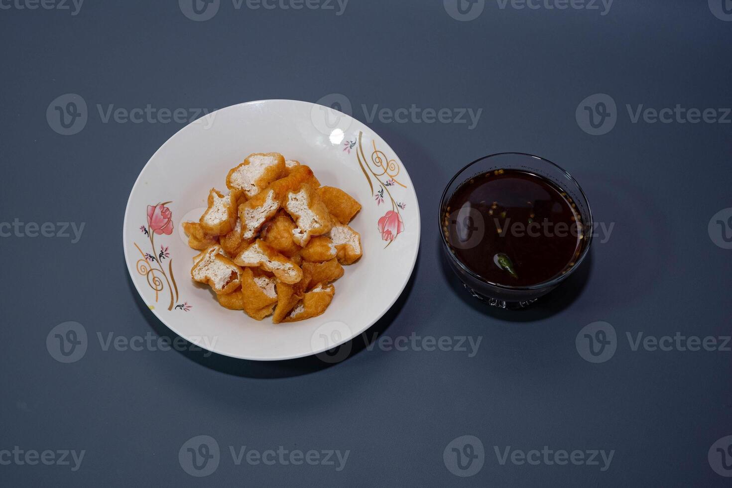Tahu gejrot is a traditional Indonesian snack. Tahu Gejrot is a typical Indonesian spicy food. Made from fried tofu cut into small pieces, photo