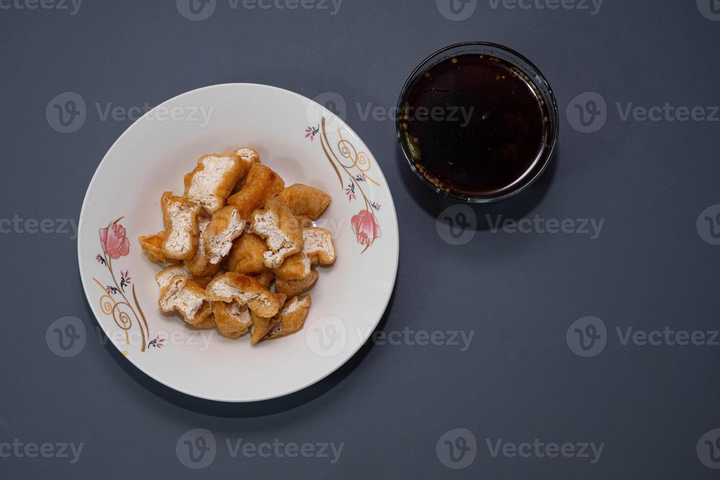 Tahu gejrot is a traditional Indonesian snack. Tahu Gejrot is a typical Indonesian spicy food. Made from fried tofu cut into small pieces, photo