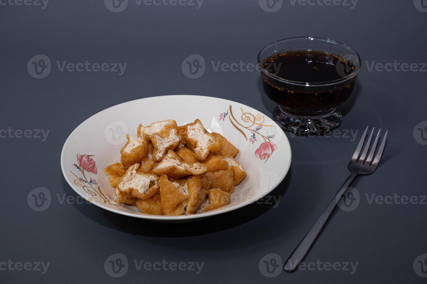 Tahu gejrot is a traditional Indonesian snack. Tahu Gejrot is a typical Indonesian spicy food. Made from fried tofu cut into small pieces, photo