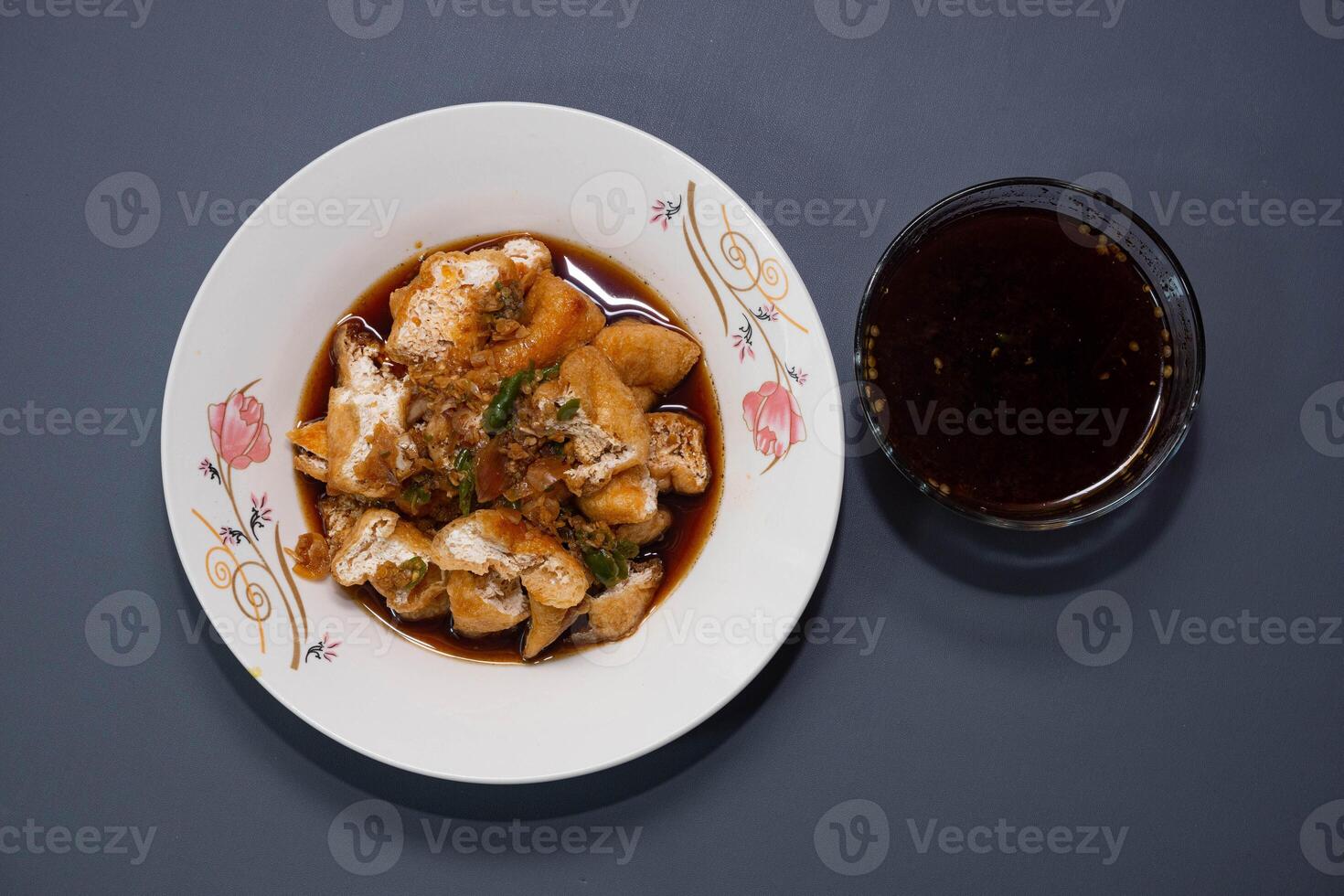 Tahu gejrot is a traditional Indonesian snack. Tahu Gejrot is a typical Indonesian spicy food. Made from fried tofu cut into small pieces, photo