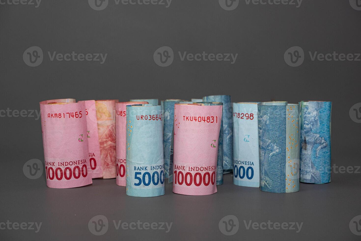 Indonesia banknote The rupiah is the official currency of Indonesia. In grey background. With copy space photo