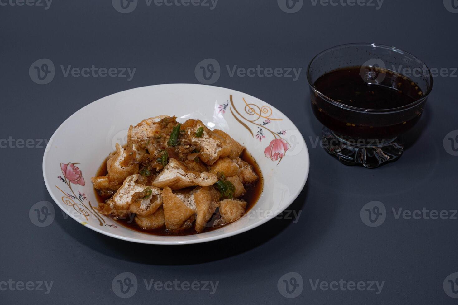 Tahu gejrot is a traditional Indonesian snack. Tahu Gejrot is a typical Indonesian spicy food. Made from fried tofu cut into small pieces, photo