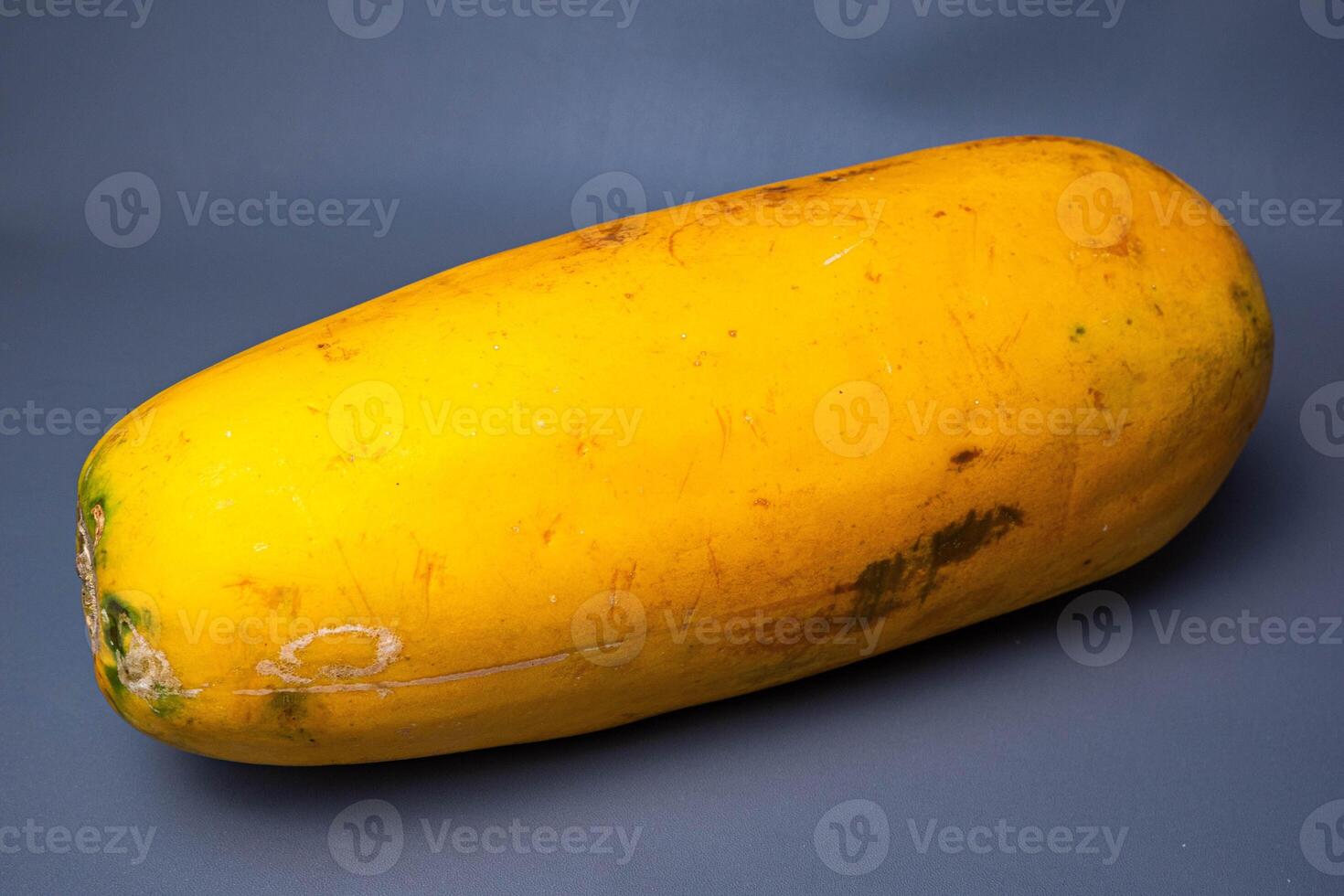 Papaya isolated on grey background. Clipping path. Fruit with vitamin A photo