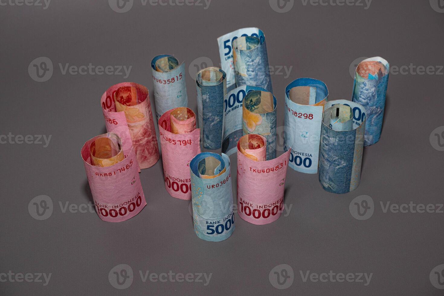 Indonesia banknote The rupiah is the official currency of Indonesia. In grey background. With copy space photo