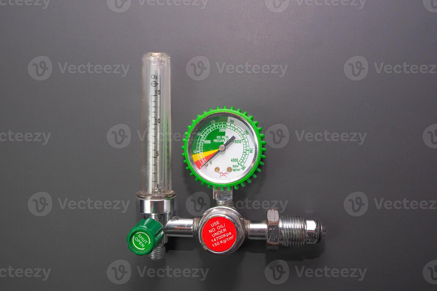 Medical Oxygen Equipment and Cylinder Regulator gauges. Pressure oxygen gas control for patient respiratory disease treatment and emergency CPR in Hospital, Focus close up on gray background. photo