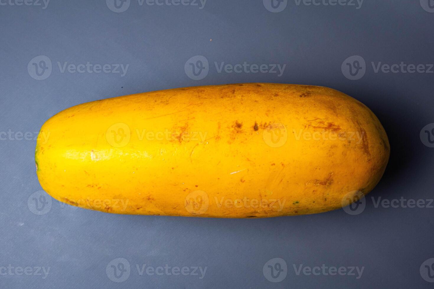Papaya isolated on grey background. Clipping path. Fruit with vitamin A photo