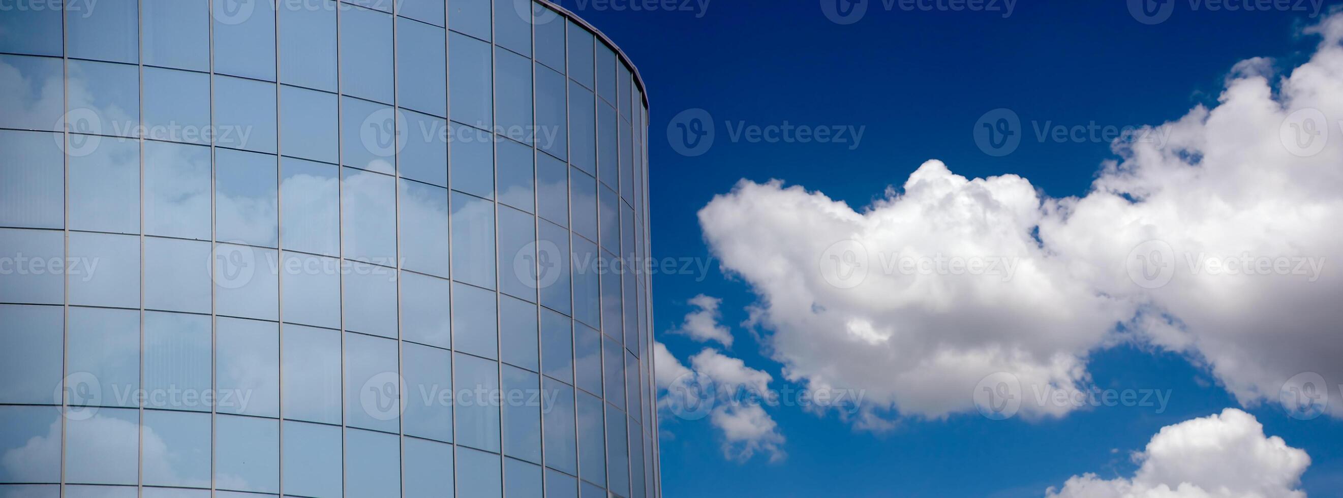 Corporate building and clouds photo