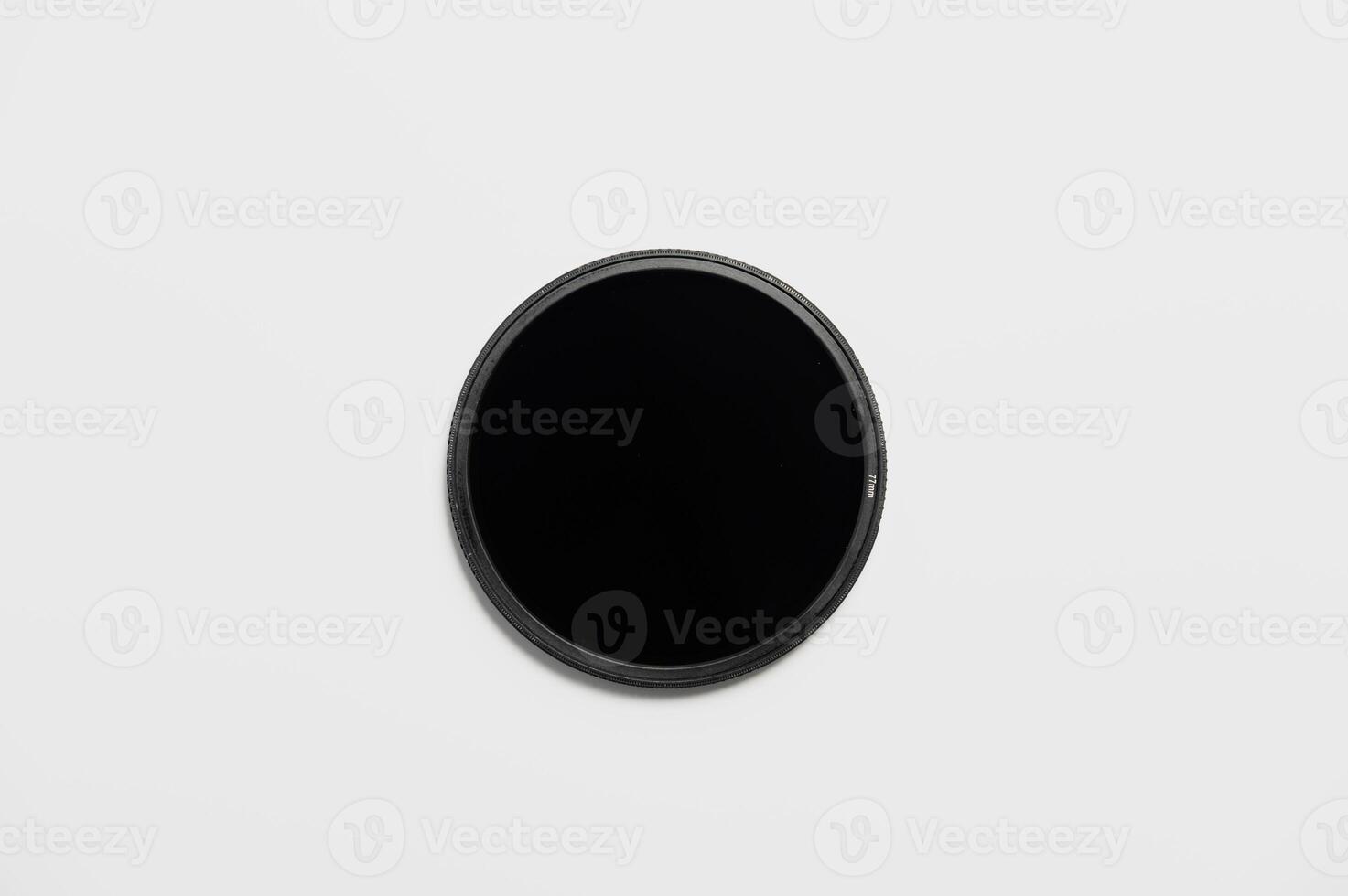 Dark ND filter on a white background. Flat image neutral density filter photo