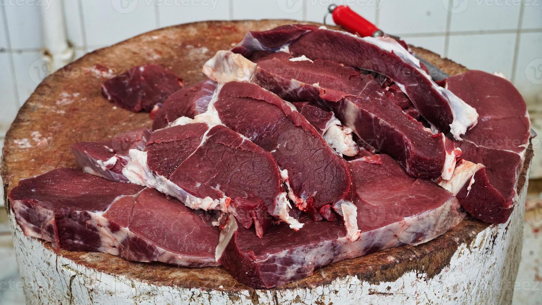 Fresh Beef Cuts on Wooden Butcher Block photo