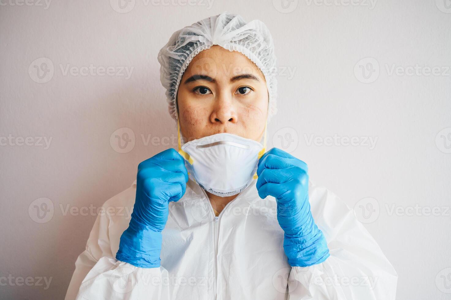 Healthcare worker with acne and facial wounds occur from a medical mask after work for a long time in hospital during covid-19 pandemic. Wearing mask for prolonged periods can damage the skin. photo