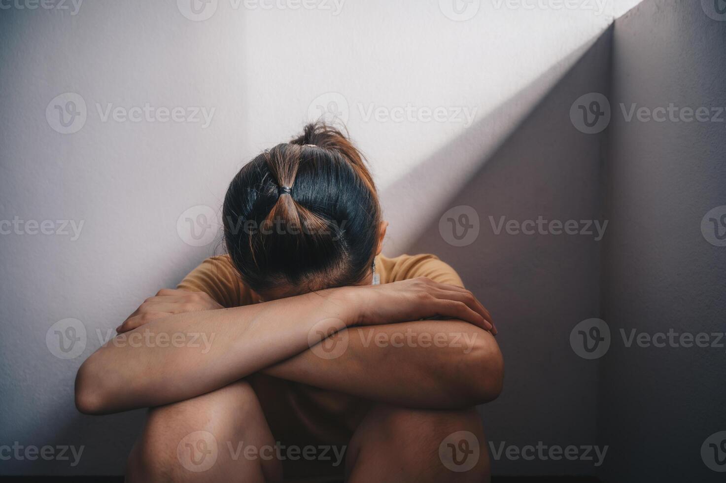 Portrait of sadness or depressed woman crying after failure and layoff from work because impact from covid-19 pandemic outbreak. Conceptual of unemployed woman having negative feelings. photo