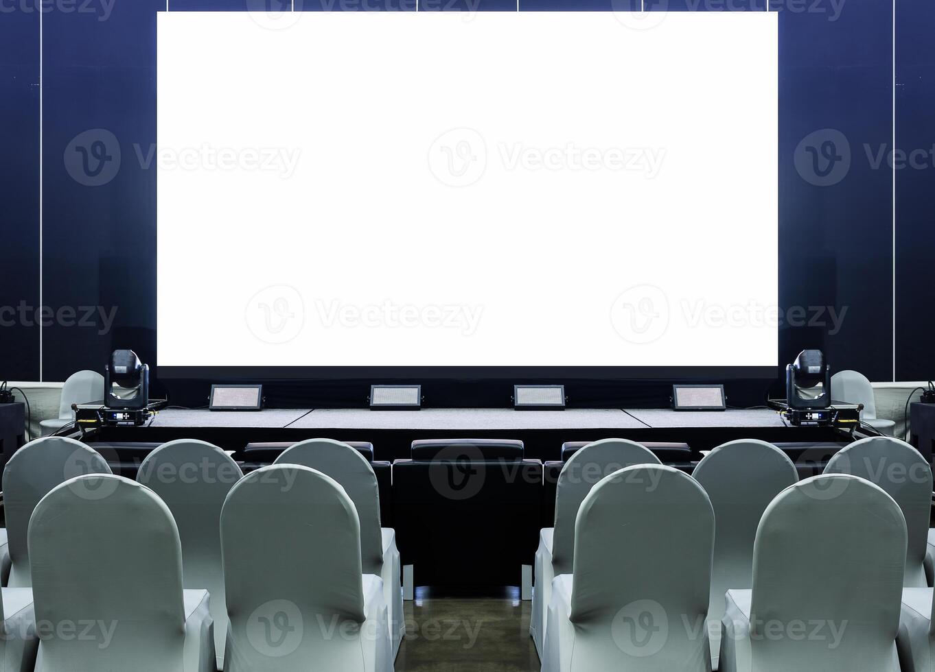 White screen display on stage with chairs for audience at business presentation exhibition photo