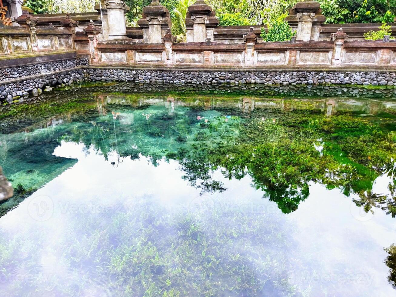 Pura Tirta Empul - Hindu Balinese temple with a bathing area containing holy spring water for ritual purification photo