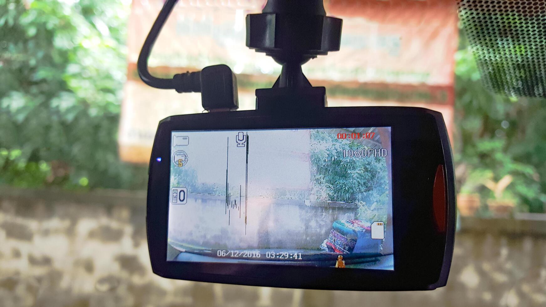Malfunctioning car CCTV monitor displaying distorted lines, concept of car insurance photo