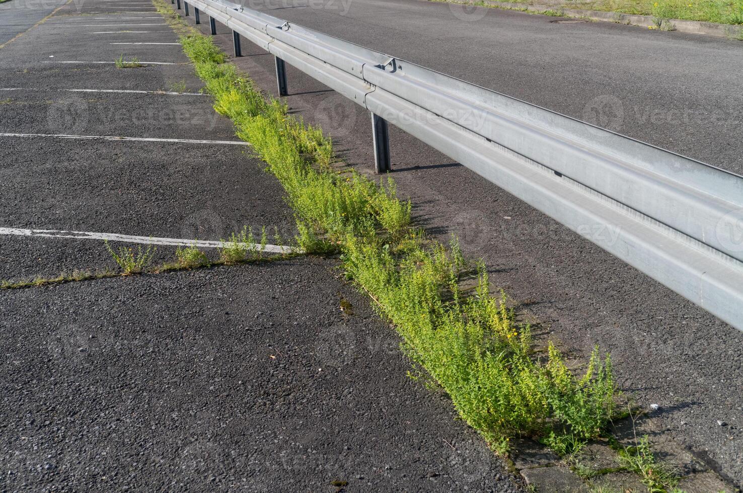 Guard rails on the road in the sun photo