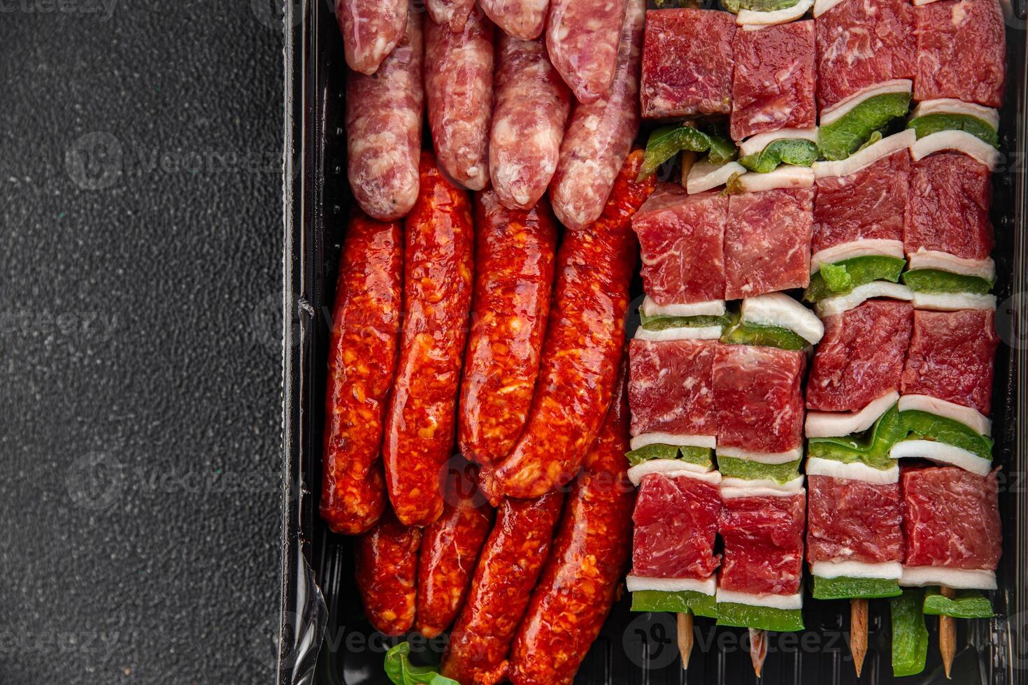 sausage meat assorted juicy pork, beef fresh delicious gourmet food background on the table rustick food top view copy space photo