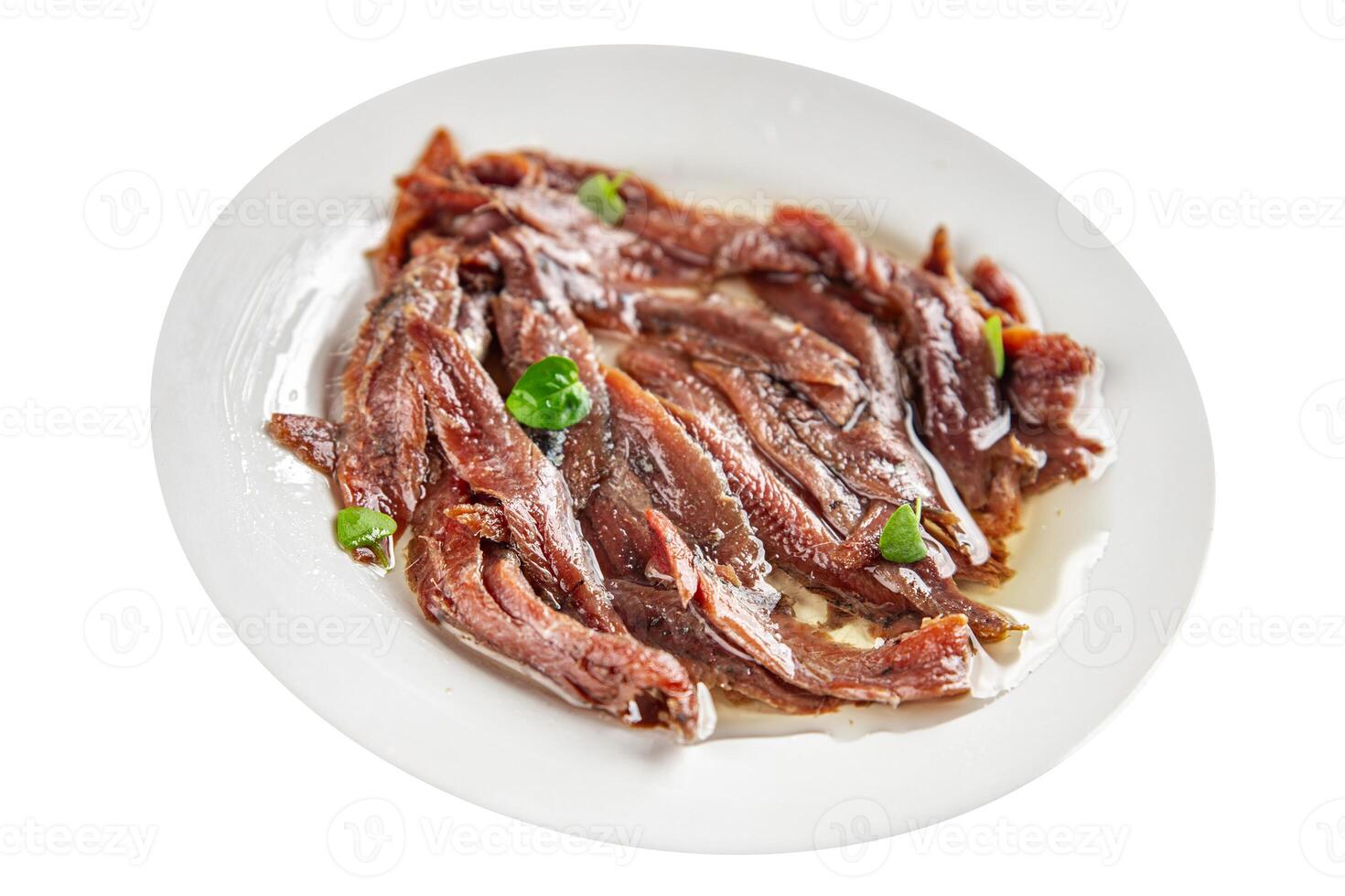 anchovies in a plate on the table canned fish in oil fresh and tasty seafood meal food snack on the table copy space food background rustic photo