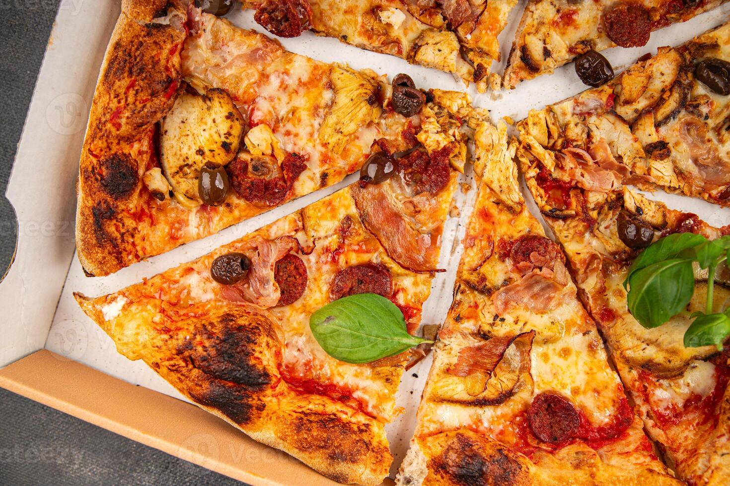 pizza chicken meat, sausages, olives, cheese, tomato saucefresh meal food snack on the table copy space food background photo