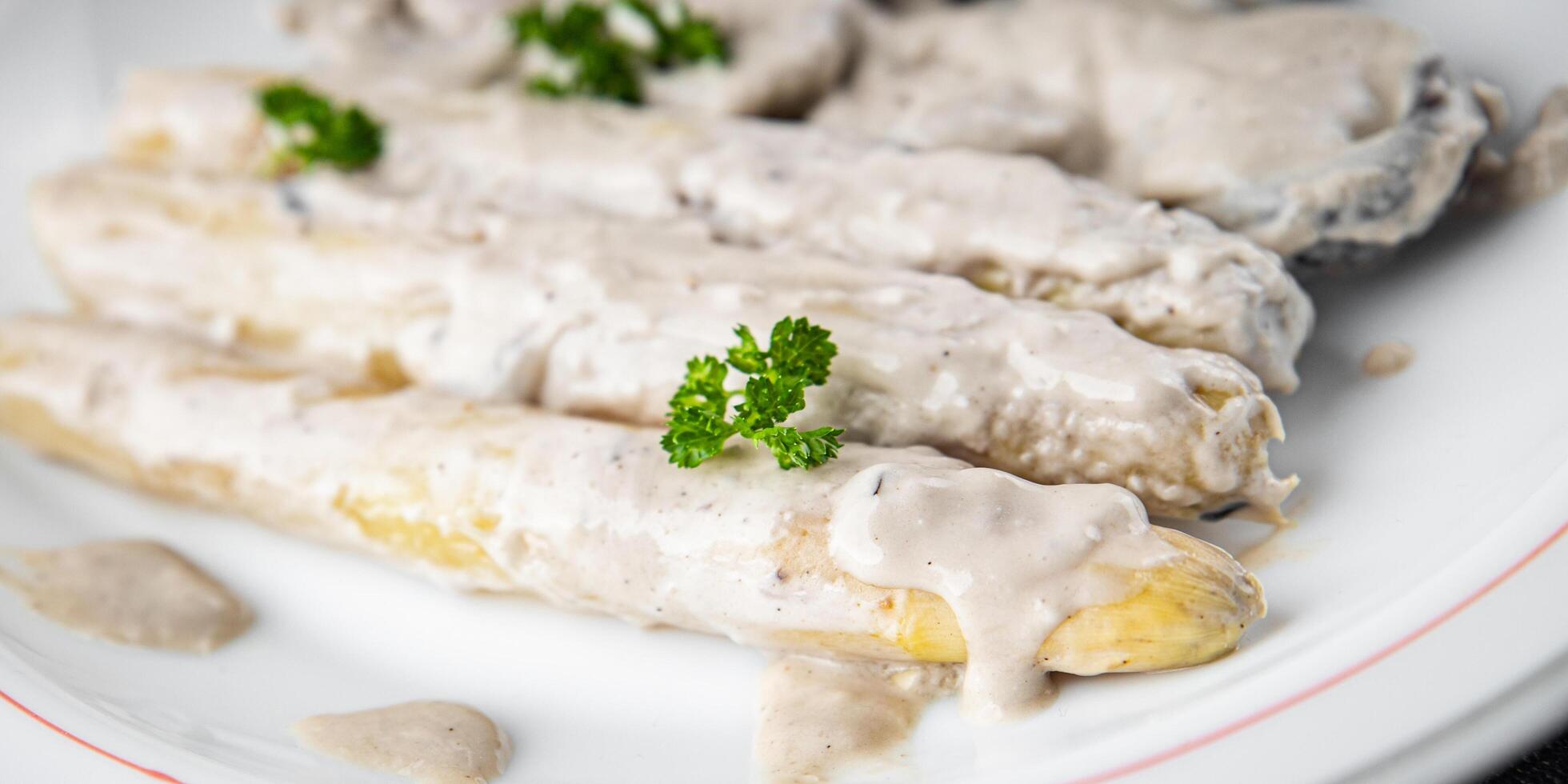 white asparagus in cream sauce fresh meal food snack on the table copy space food background rustic top view photo