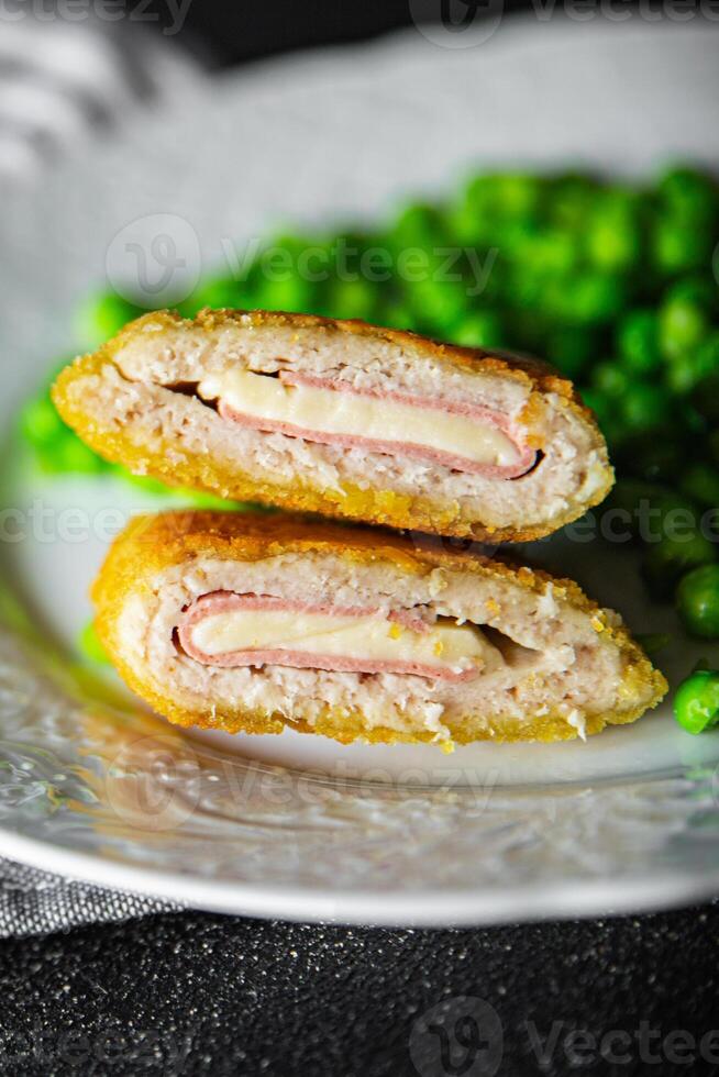 cutlet cordon bleu chicken meat, cheese, bacon meal snack on the table copy space food background rustic top view photo