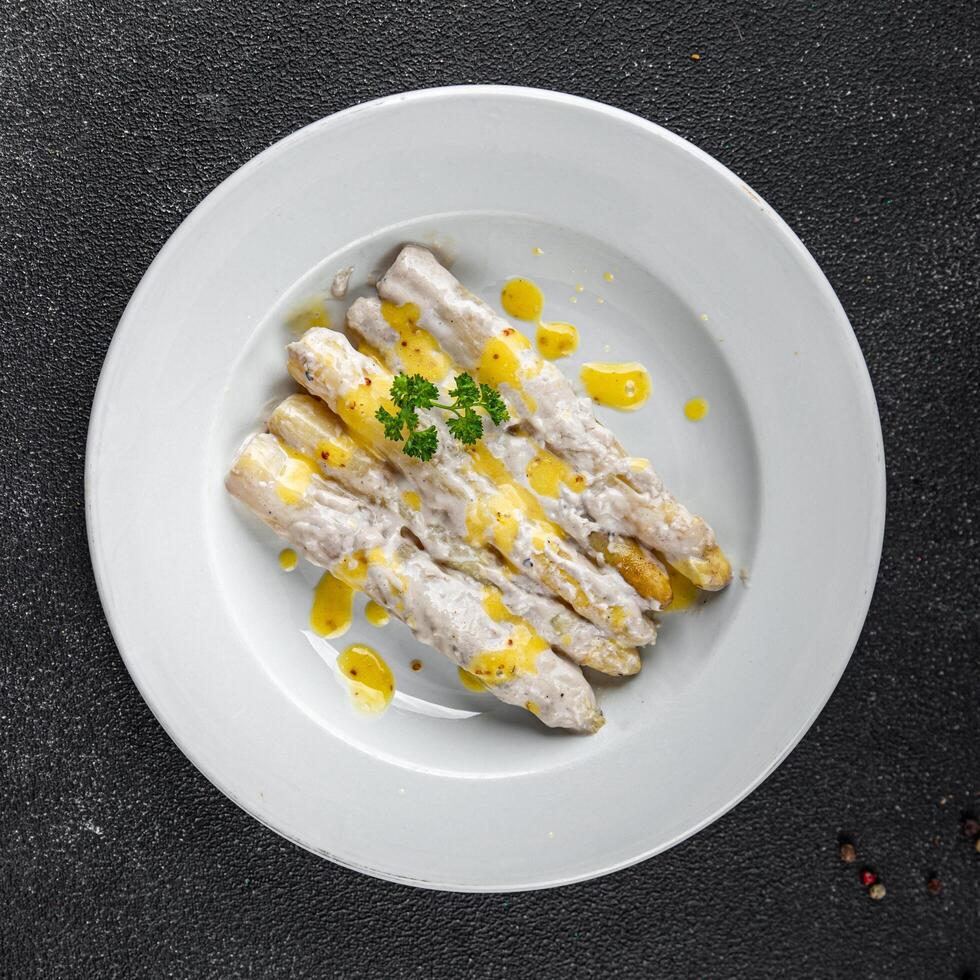 white asparagus in cream sauce fresh meal food snack on the table copy space food background rustic top view photo