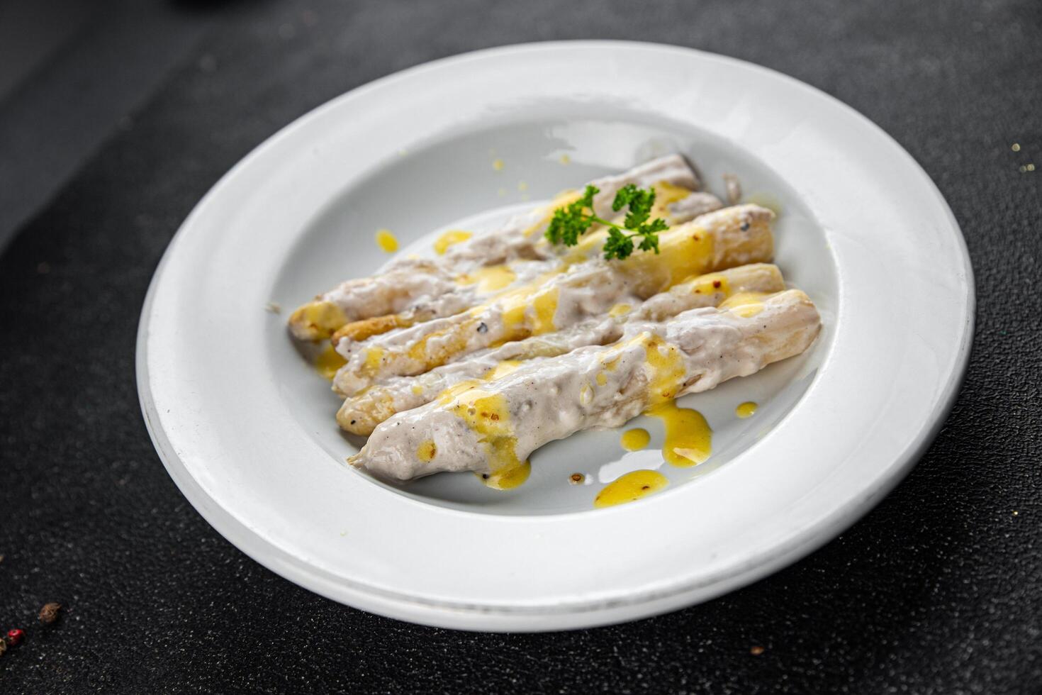 white asparagus in cream sauce fresh meal food snack on the table copy space food background rustic top view photo