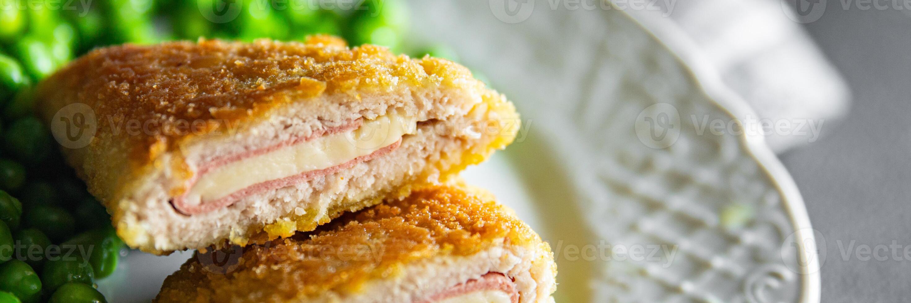 cutlet cordon bleu chicken meat, cheese, bacon meal snack on the table copy space food background rustic top view photo