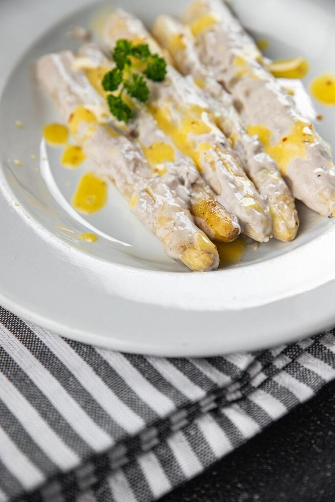 white asparagus in cream sauce fresh meal food snack on the table copy space food background rustic top view photo