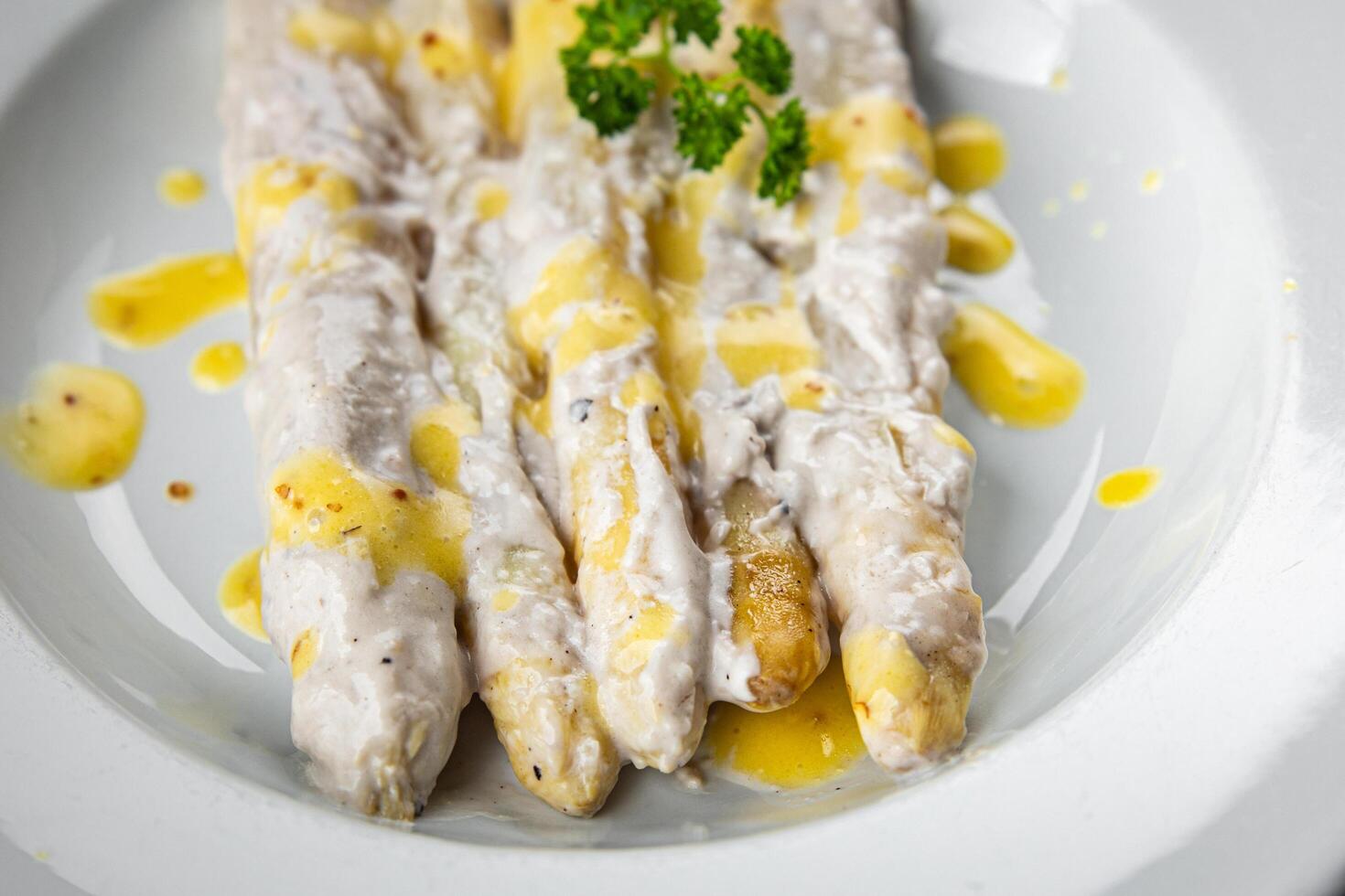 white asparagus in cream sauce fresh meal food snack on the table copy space food background rustic top view photo