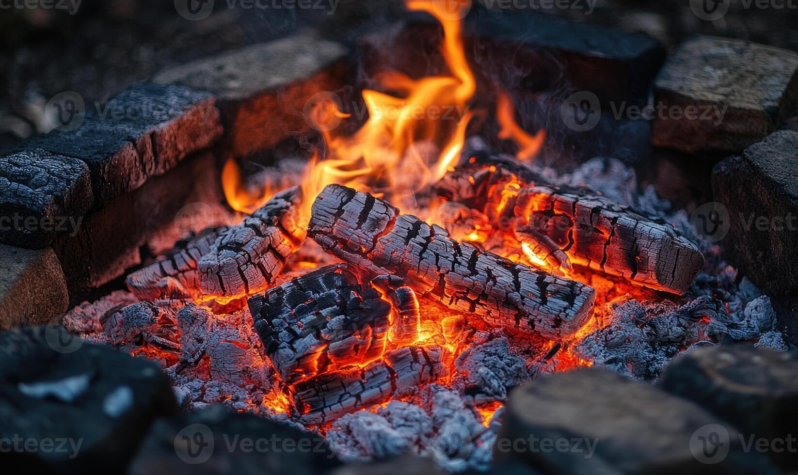 Fire crackling in a rustic stone hearth, glowing embers photo
