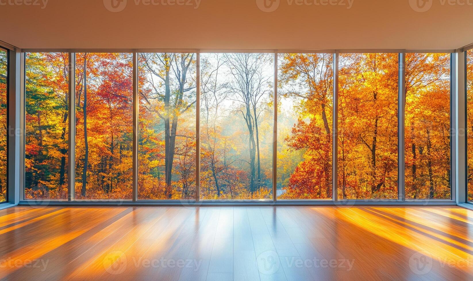 Bright space, floor-to-ceiling window, view of misty autumn woods outside, colorful foliage photo