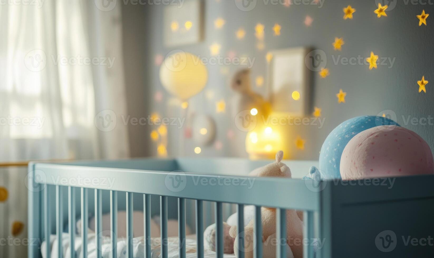 Light blue crib in a nursery with starry wallpaper photo