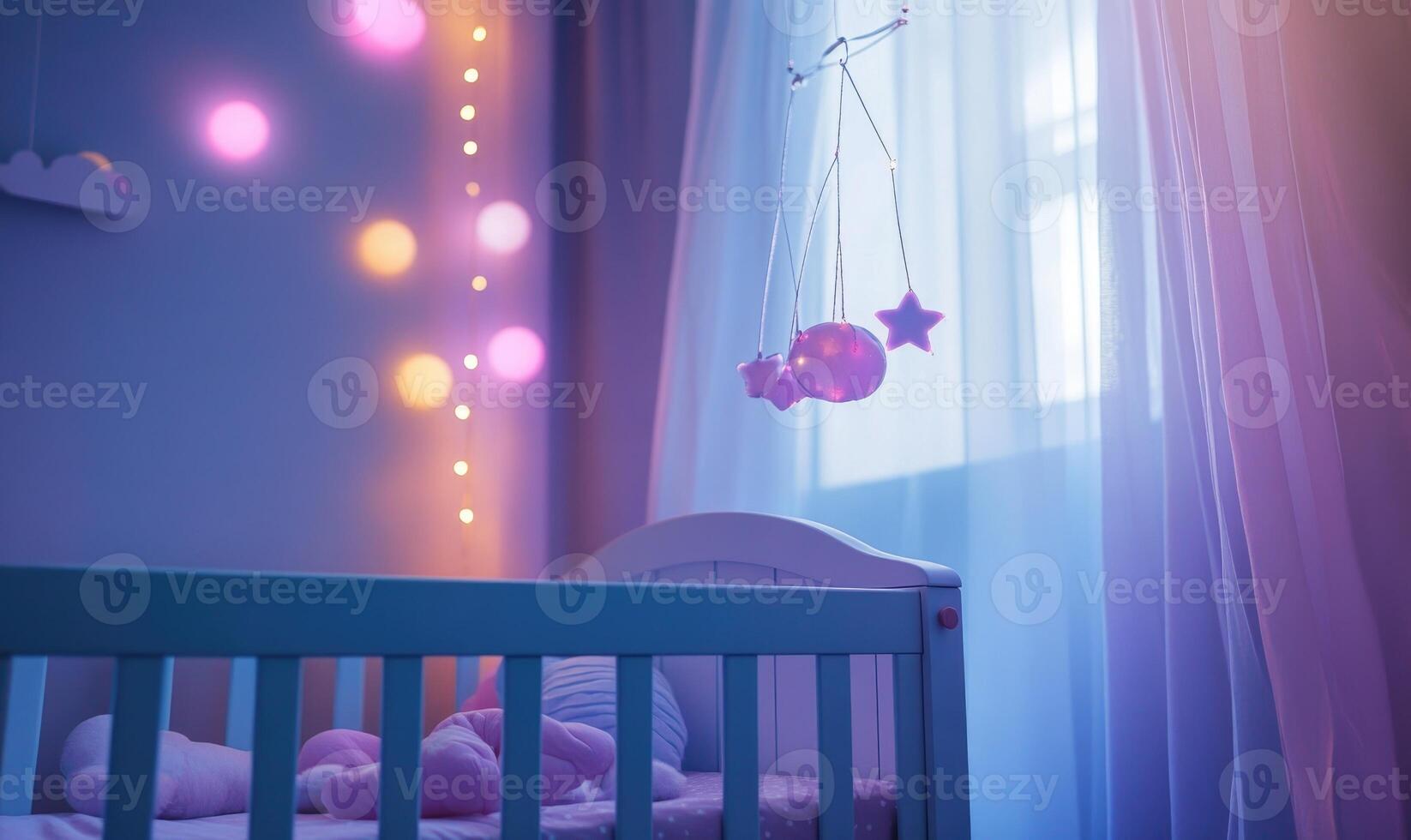 Light blue crib with soft gray bedding, glowing pink and purple lights photo