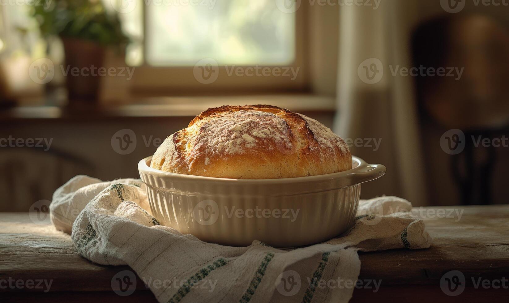 Loaf of bread in a ceramic dish, farmhouse feel photo