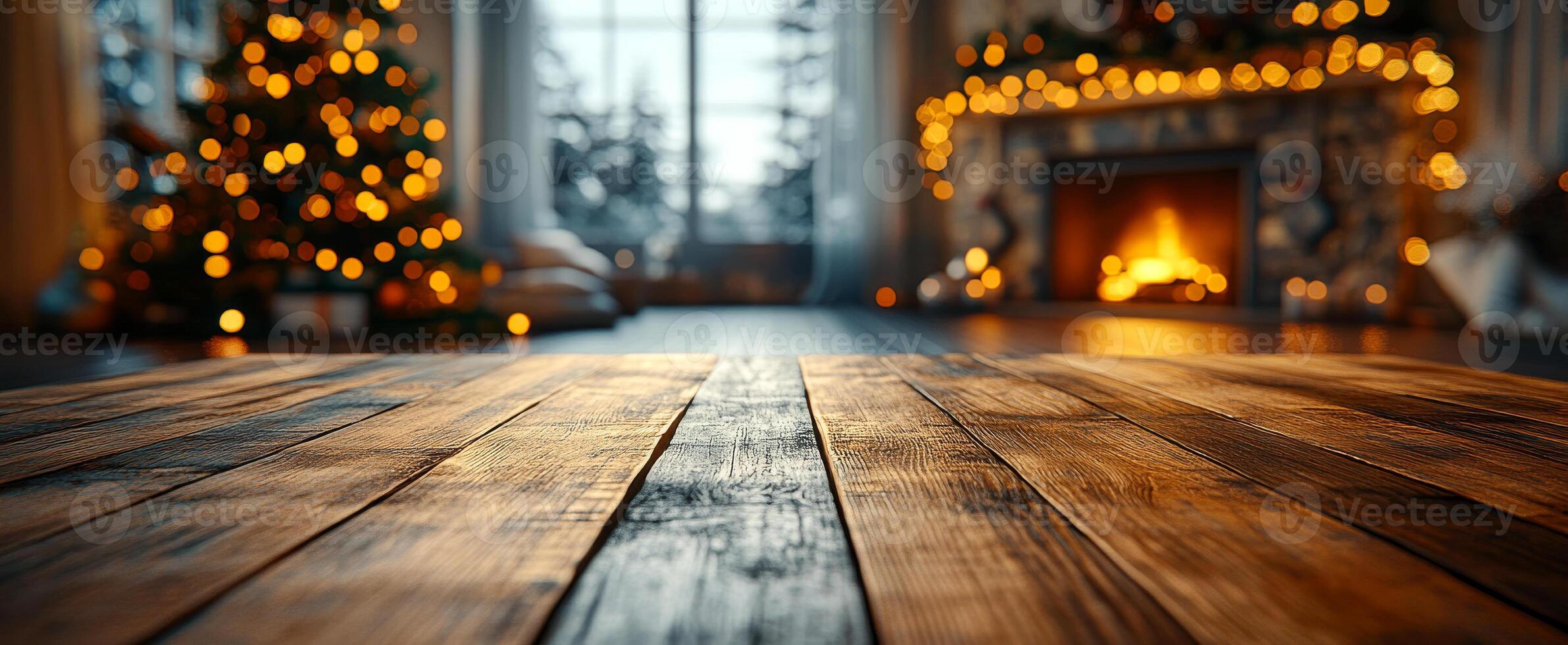 A Christmas tree is lit up in a room with a fireplace. The room is decorated with lights and presents photo