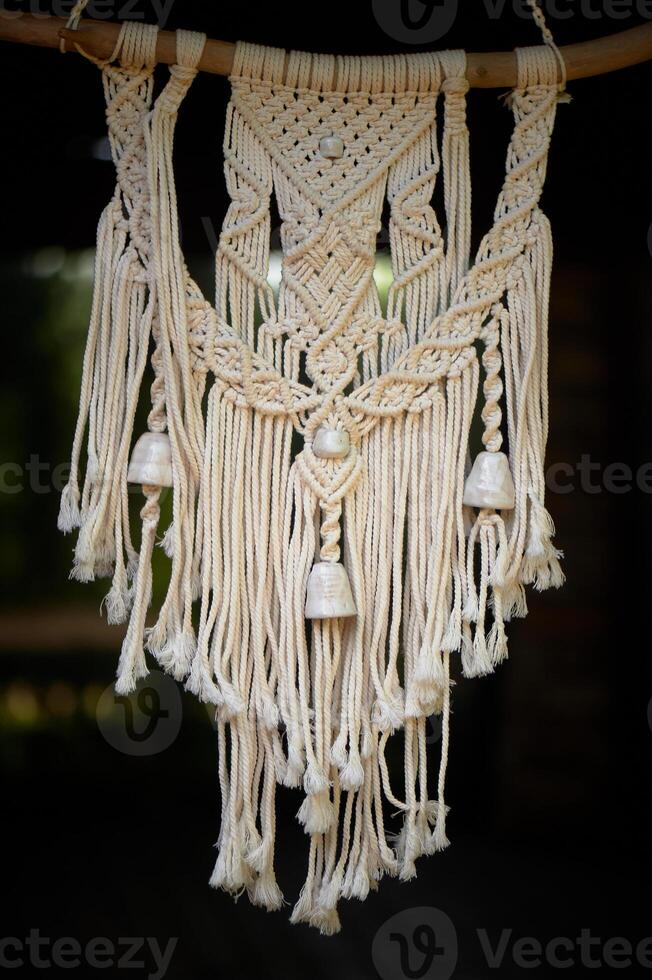 Macram weaving. Light thread with large beads. Near. Boho style photo